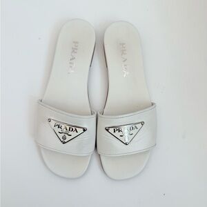 Prada white leather Triangle logo embellished open toe flat slide sandals 37